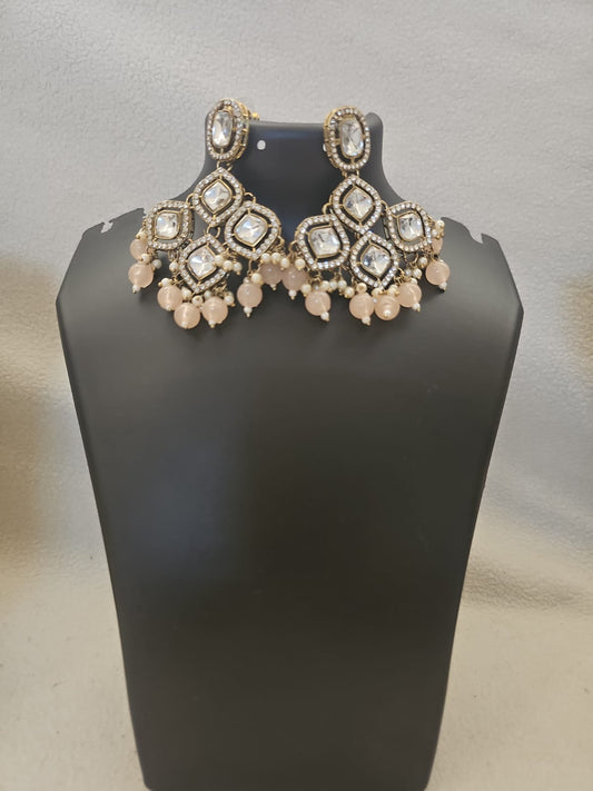 earring pale pink round shape